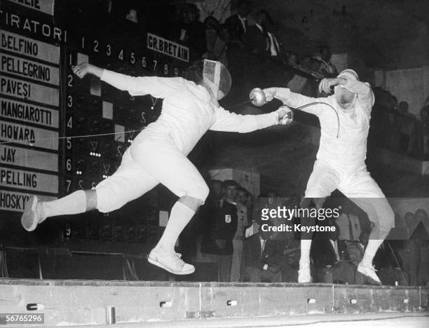 Giuseppe Delfino of Italy scores a winning hit on Allen Jay of Great Britain to take the gold in the Men's Individual Epee at the Rome Olympics, 1960