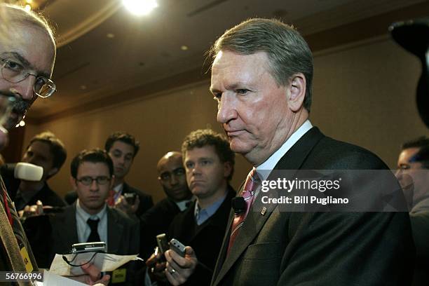 General Motors Chairman and Chief Executive Officer Rick Wagoner is surrounded by the media after announcing additional cost cuting actions to...