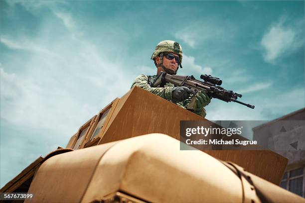 army soldier stands guard in combat in humvee - fight for the troops stock pictures, royalty-free photos & images