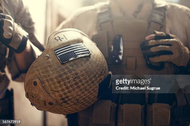 american flag on helmet of us marine soldier. - us marine corps stock pictures, royalty-free photos & images