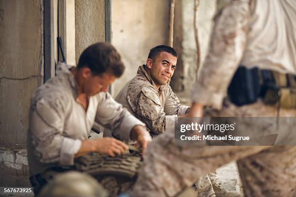 united states marines relax in combat. - usa military uniform stock pictures, royalty-free photos & images