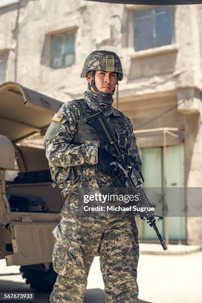 united states marine poses for a portrait. - army soldier photos et images de collection