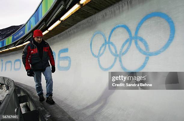 Georg Hackl of Germany surveys the course during the Mens Luge Training prior to the Turin 2006 Winter Olympic Games on February 7, 2006 in Cesana...