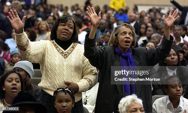 Monice Finley of Tyler, Texas prays along with an overflow crowd in the Samson's Health and Fitness Center next to the New Birth Missionary Baptist...