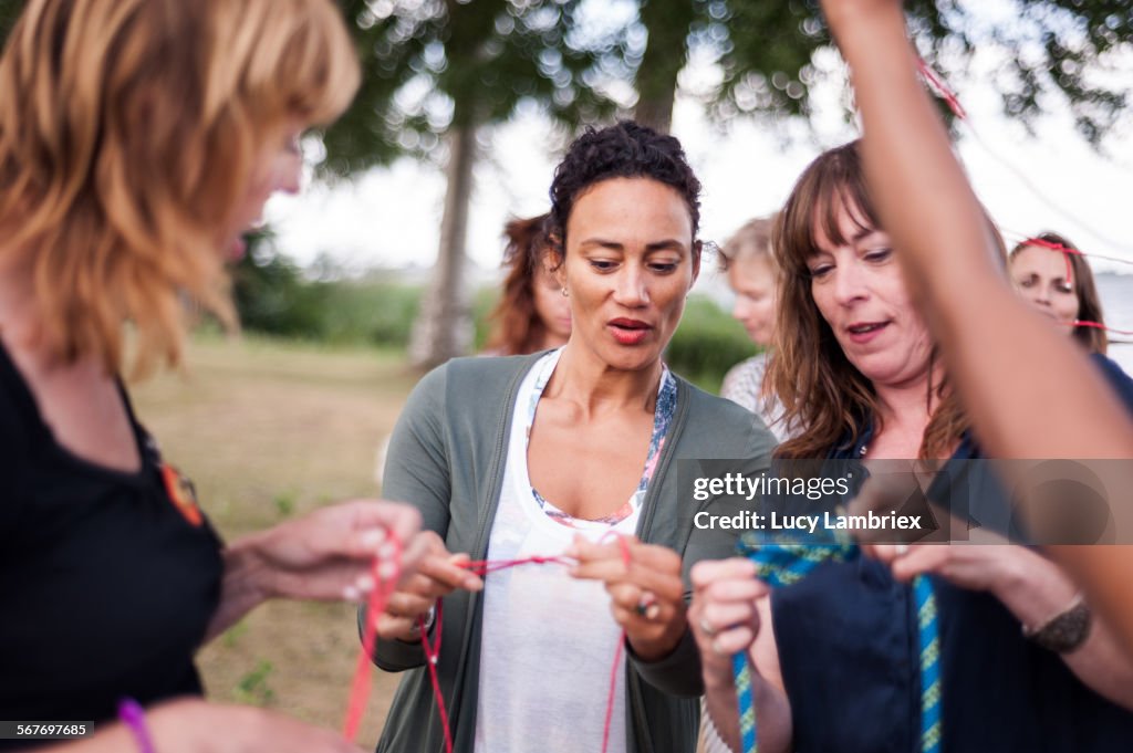 Woman teaching other women to tie knots