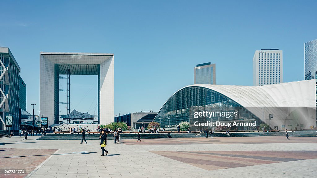 Pedestrains walk the Esplanade la Defense