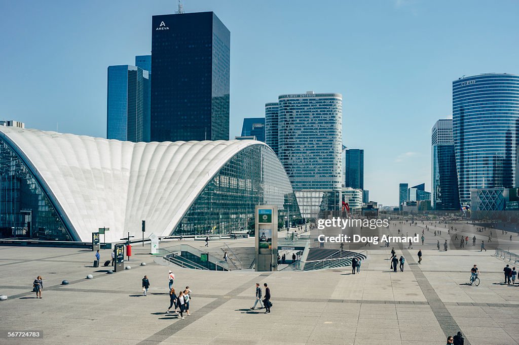 Pedestrains walk the Esplanade la Defense