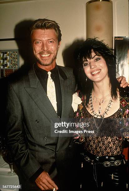 David Bowie visits Joan Jett backstage when Joan Jett & the Blackhearts perform on Broadway circa 1989 in New York City.