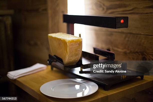 raclette cheese on grill, crans-montana, swiss alps, switzerland - cheese stock photos et images de collection
