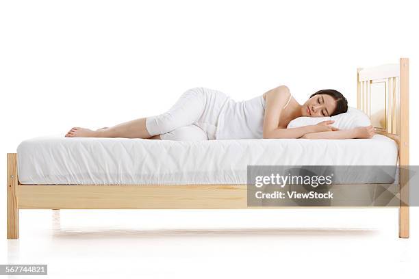 a young woman was sleeping - acostado de lado fotografías e imágenes de stock