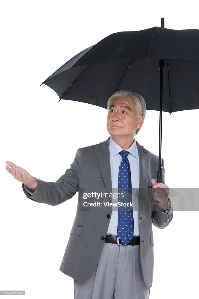 A business and old man with an umbrella