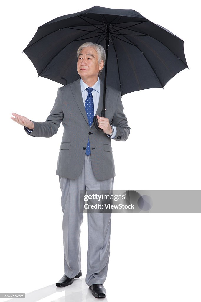 A business and old man with an umbrella