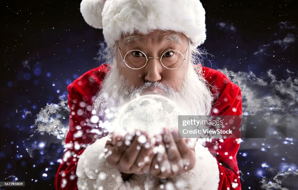 An elderly man dressed in a Santa suit