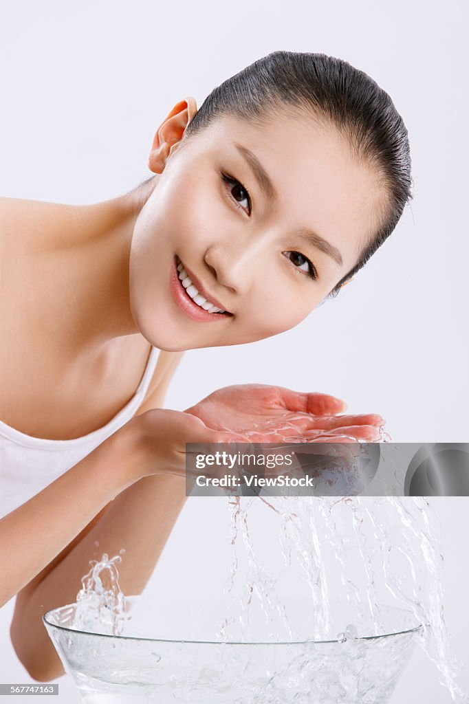 Young women are using water cleansing