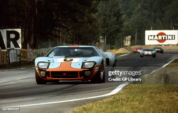 Le Mans 24 Hours 15th June 1969. Jacky Ickx/Jackie Oliver, Ford GT40, race winner. Car no 7 in background David Hobbs/Mike Hailwood, Ford GT40,...