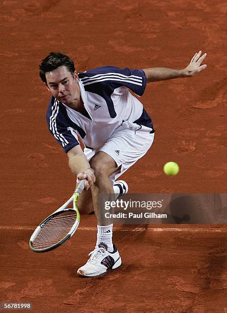 Australian Davis Cup Team Coach Todd Woodbridge hits a forehand during an Australian practice session prior to the Davis Cup first round match...