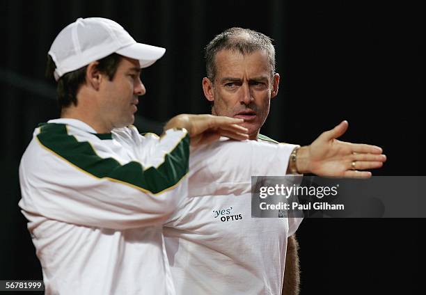 Australian Davis Cup Team Captain John Fitzgerald talks to Coach Todd Woodbridge during an Australian practice session prior to the Davis Cup first...