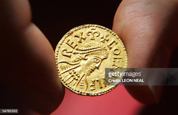 United Kingdom: A curator from the British Museum in London holds holds a unique Anglo-Saxon coin depicting Coenwulf King of Merica 08 February 2006....