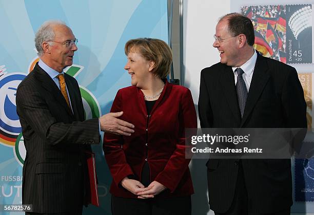 German Chancellor Angela Merkel smiles as Franz Beckenbauer , President of the Local Organising Committee for the FIFA World Cup Germany 2006 and...