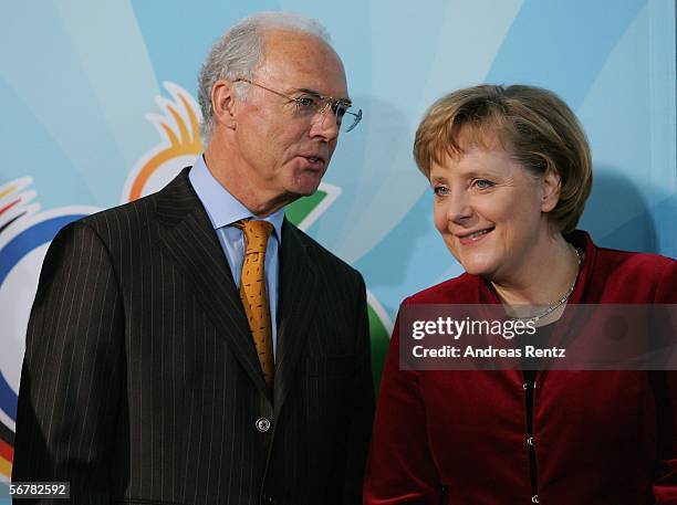 German Chancellor Angela Merkel welcomes Franz Beckenbauer during a presentation of Sport 2006 special edition stamps at the chancellery on February...