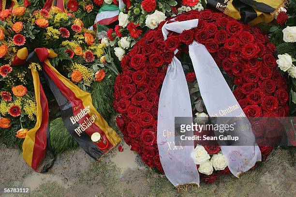 Wreath bearing the names of the wife and children of late former German President Johannes Rau lies among other wreaths covering Rau's grave February...