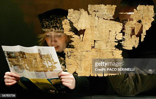 Woman visits the exhibition of The Papyrus of Artemidorus, the exceptional artefact from the Ptolematic period, exposed to the Palazzo Bricherasio in...