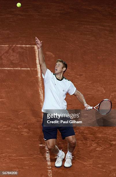 Chris Guccione of Australia practices his serving during an Australian practice session prior to the Davis Cup first round match between Switzerland...