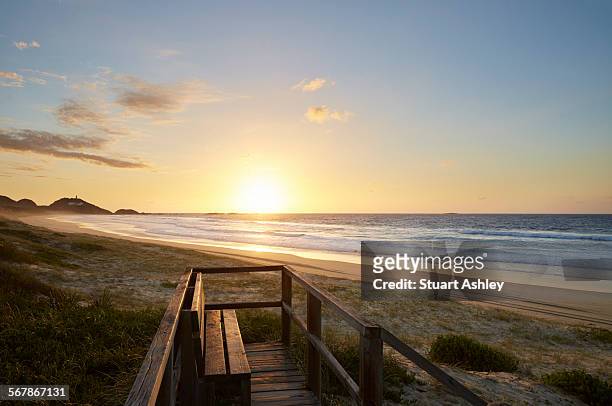 sunset looking over beach - sunset foto e immagini stock