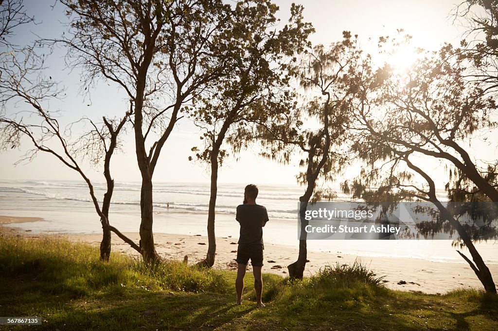 Man looks beach in the early morning