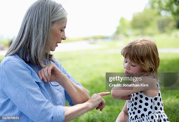grandmother and granddaughter - sleeveless shirt stock pictures, royalty-free photos & images