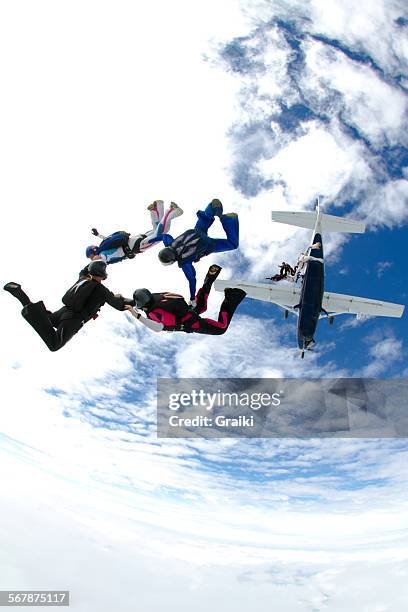 skydivers group exit from the plane - paratrooper plane stock pictures, royalty-free photos & images