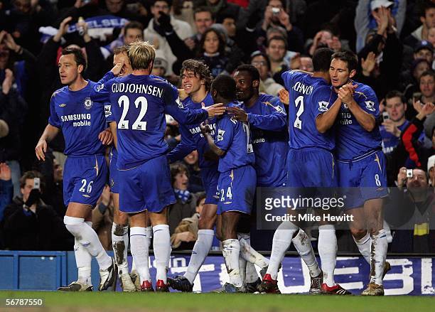 Hernan Crespo of Chelsea is congratulated by team mates after scoring the third goal of the night during the FA Cup Fourth Round Replay match between...