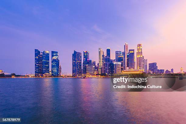 skyscrapers, singapore skyline and waterfront - merlion stock pictures, royalty-free photos & images