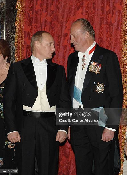 Russian President Vladimir Putin and King Juan Carlos of Spain speak before attending an official dinner in honour of Russian President Vladimir...