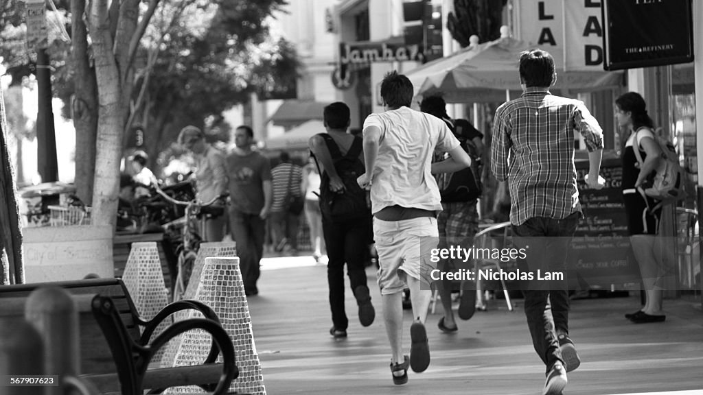 Group of Boys Running Down Street
