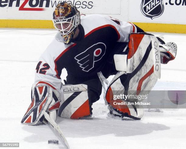 Robert Esche of the Philadelphia Flyers plays the puck against the New York Islanders on February 8, 2006 at the Wachovia Center in Philadelphia,...