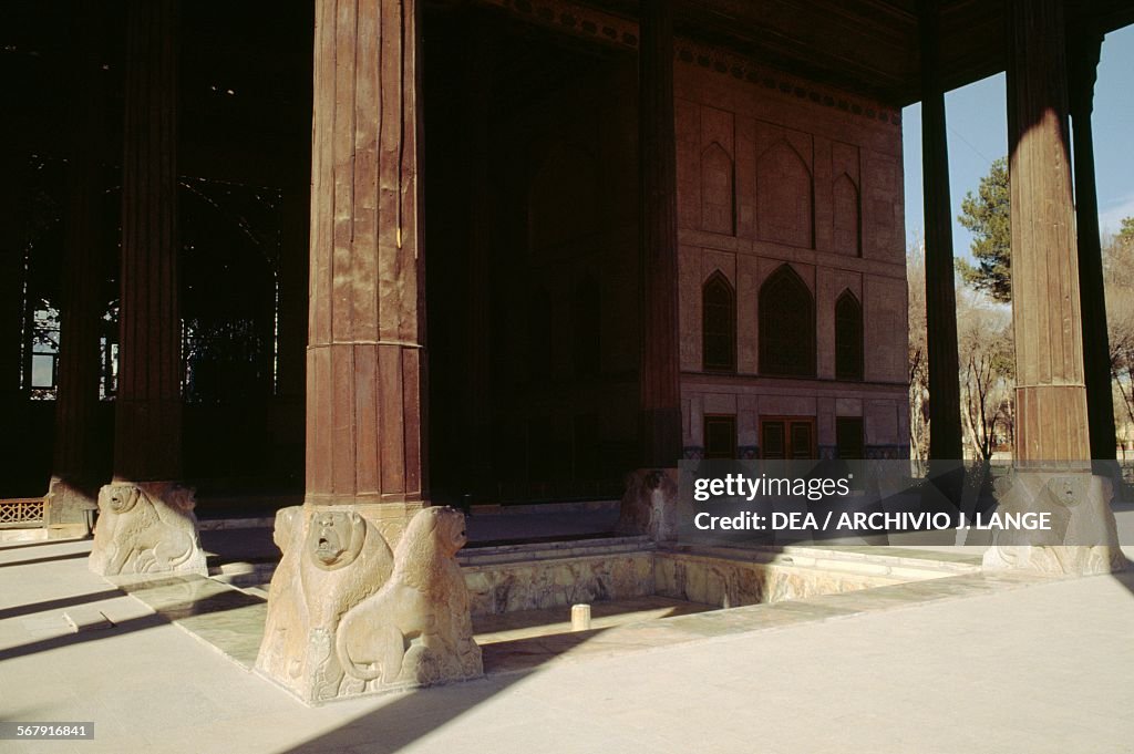 Wooden support columns on stone bases...