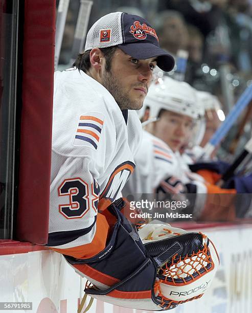 Rick DiPietro of the New York Islanders looks on from the bench as his team plays against the Philadelphia Flyers on February 8, 2006 at the Wachovia...
