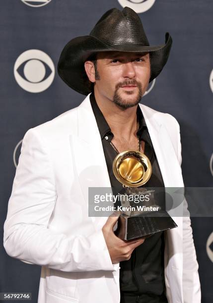 Singer Tim McGraw with his award for Best Country Collaboration with Vocals poses in the press room at the 48th Annual Grammy Awards at the Staples...