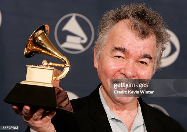 Musician John Prine poses with his award for Best Contemporary Folk Album in the press room at the 48th Annual Grammy Awards at the Staples Center on...