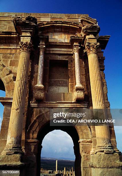 Arch on the side of the Arch of Trajan, 1st-2nd century AD, ruins of the Roman city of Timgad , founded in ca 100 AD by order of Trajan , Algeria.