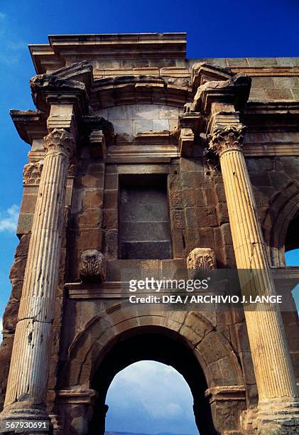Arch on the side of the Arch of Trajan, 1st-2nd century AD, ruins of the Roman city of Timgad , founded in ca 100 AD by order of Trajan , Algeria.