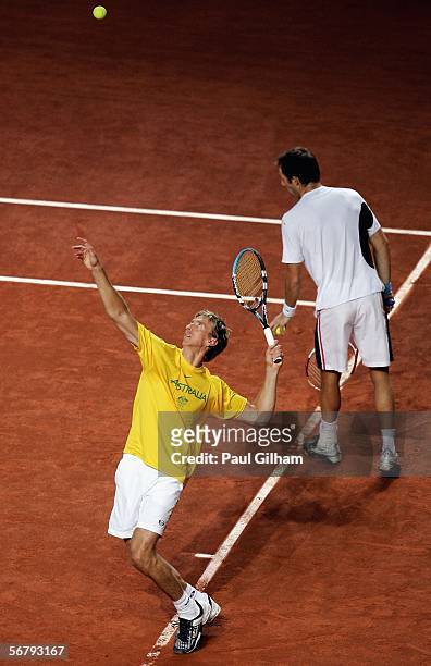 Wayne Arthurs of Australia practices his serves alongside Paul Hanley during an Australian practice session prior to the Davis Cup first round match...