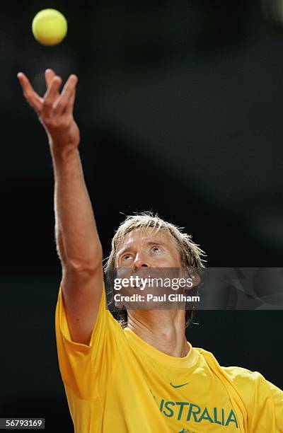 Wayne Arthurs of Australia throws a ball up as he practices his serves during an Australian practice session prior to the Davis Cup first round match...