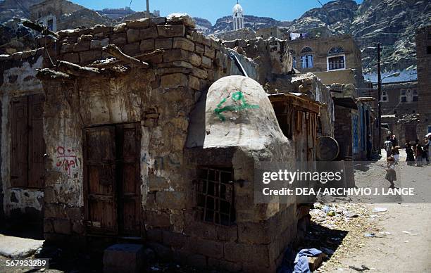 Dwellings in Shibam , in the background the Great mosque or Al-Jami'a al-Kabir mosque, Yemen.