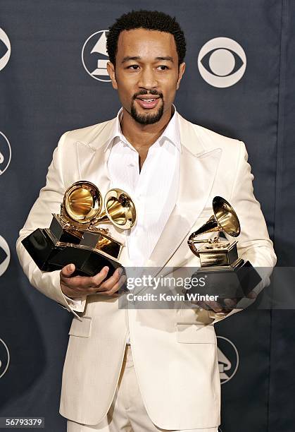 Musician John Legend with his award for Best R&B Album and Best R&B Vocal Performance poses in the press room at the 48th Annual Grammy Awards at the...