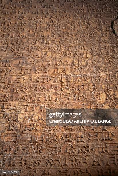 Cuneiform writing on an alabaster panel, from a palace in Nineveh, site was partially destroyed in 2015, Iraq. Assyrian civilisation, 7th century.