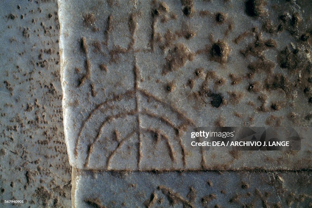 Graffito of a menorah on step of Celsus Library