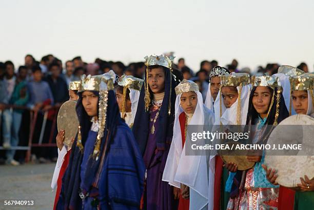 Girls in traditional costumes, Festival of the Sahara in Douz, Tunisia.