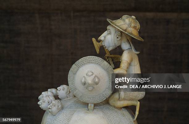 Ivory salt cellar, with a lid depicting a Portuguese soldier holding a shield, axe with his enemies' heads at his feet, Sapi-Portuguese art,...